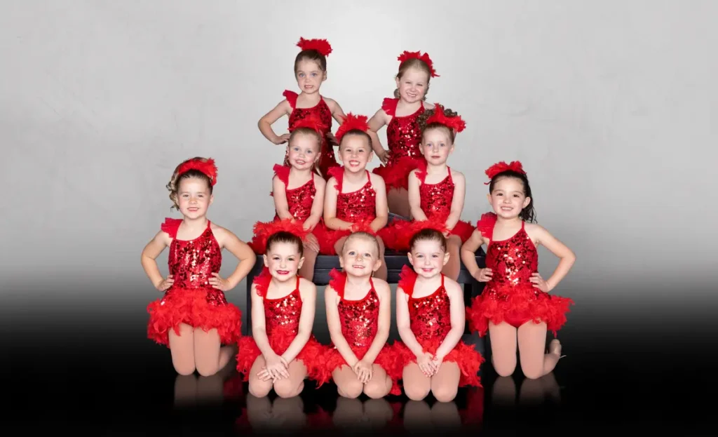 Preschool dance classes represented with group of dancers in red costumes